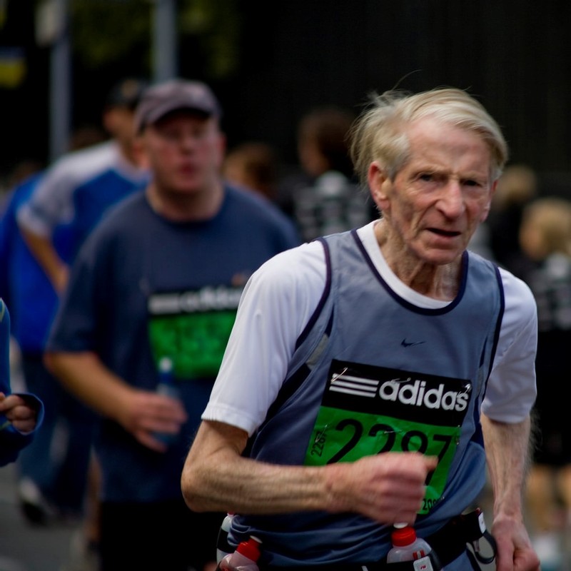 This picture shows a senior citizen running in the Dublin City Marathon.