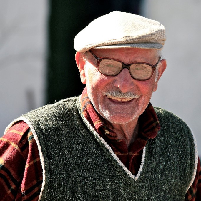 This picture shows a fit looking older gentleman smiling in the sunshine.
